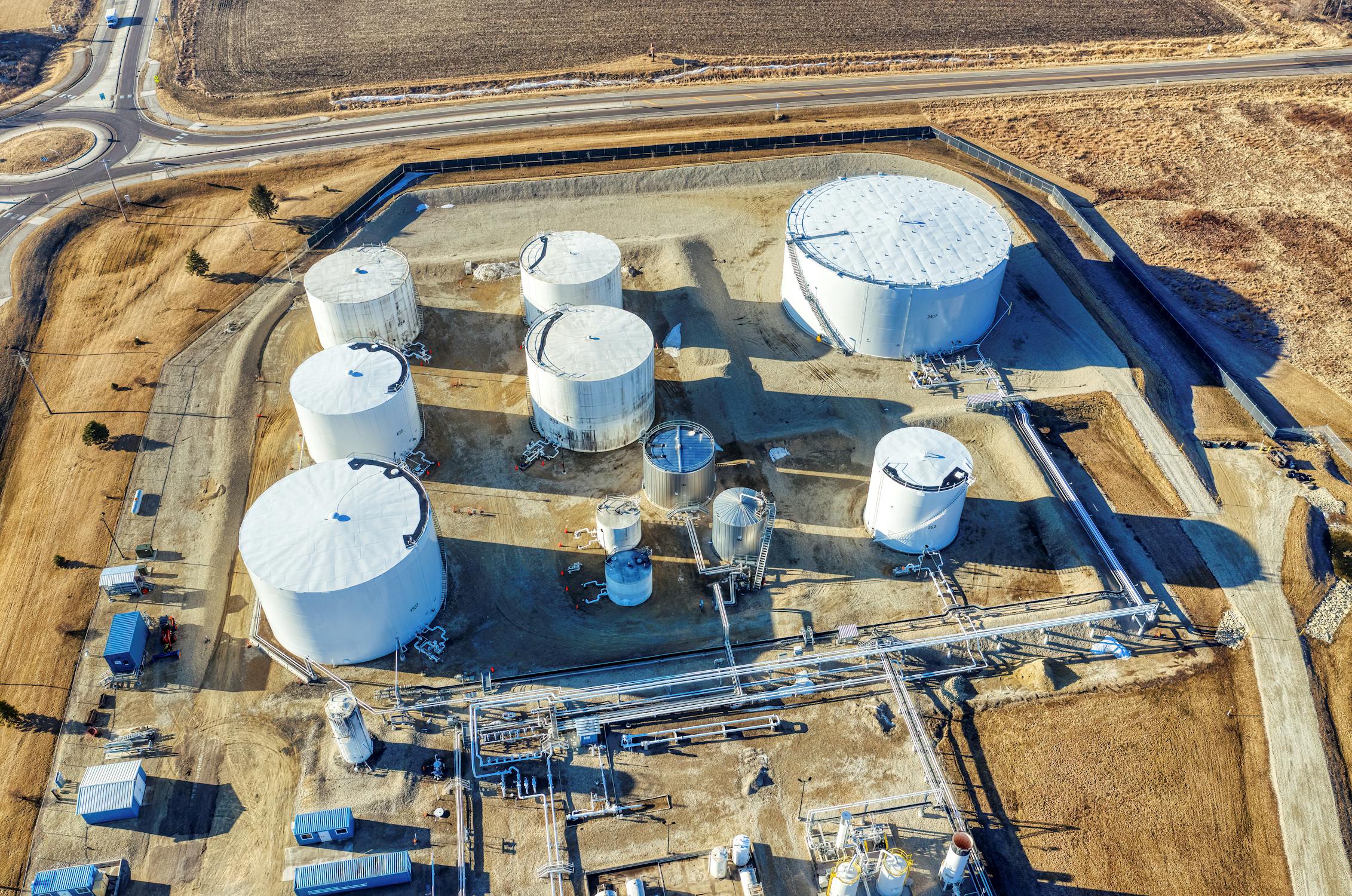 Aerial view of industrial plant with chemical storage tanks