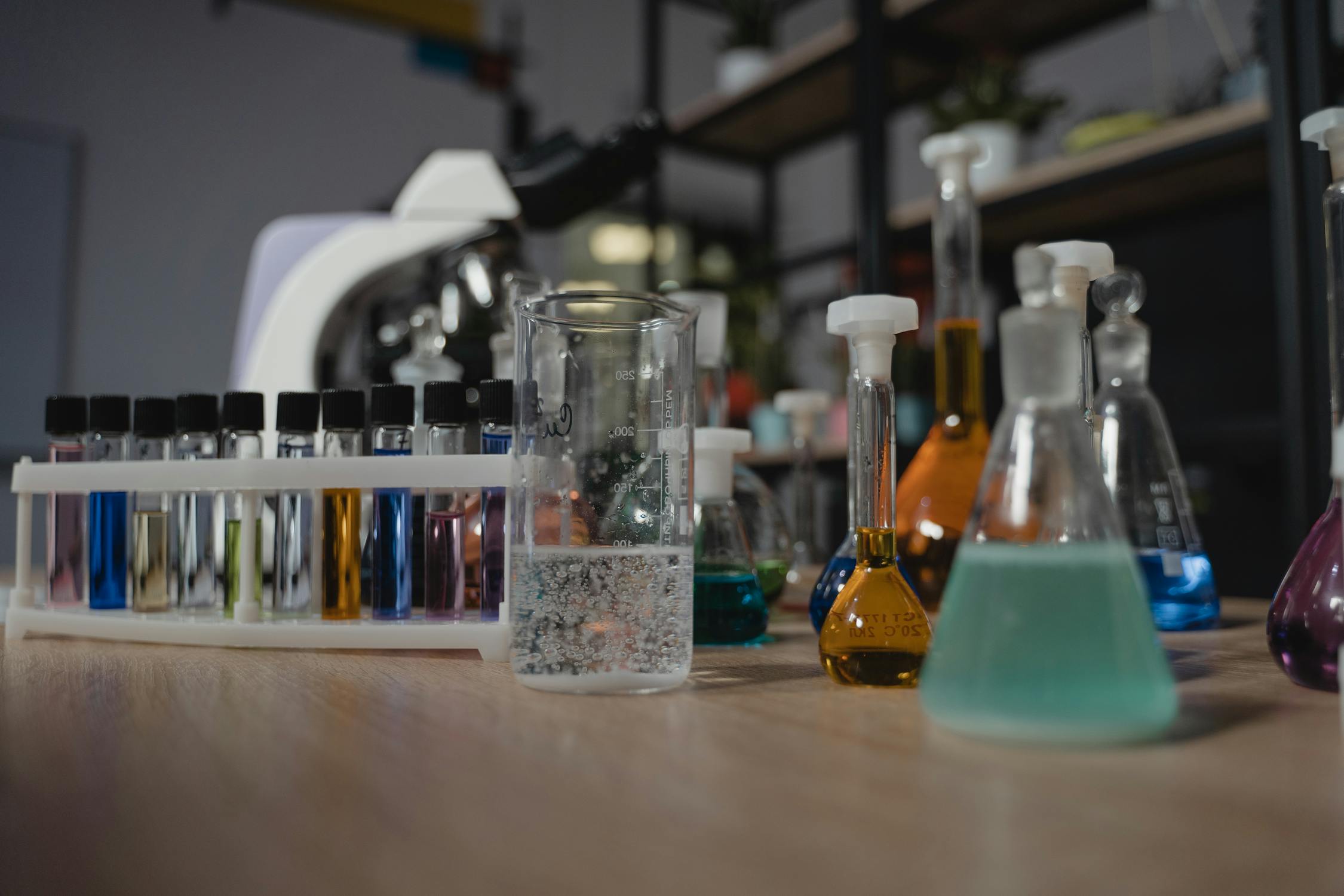 Colorful chemical flasks and beakers in a laboratory setting