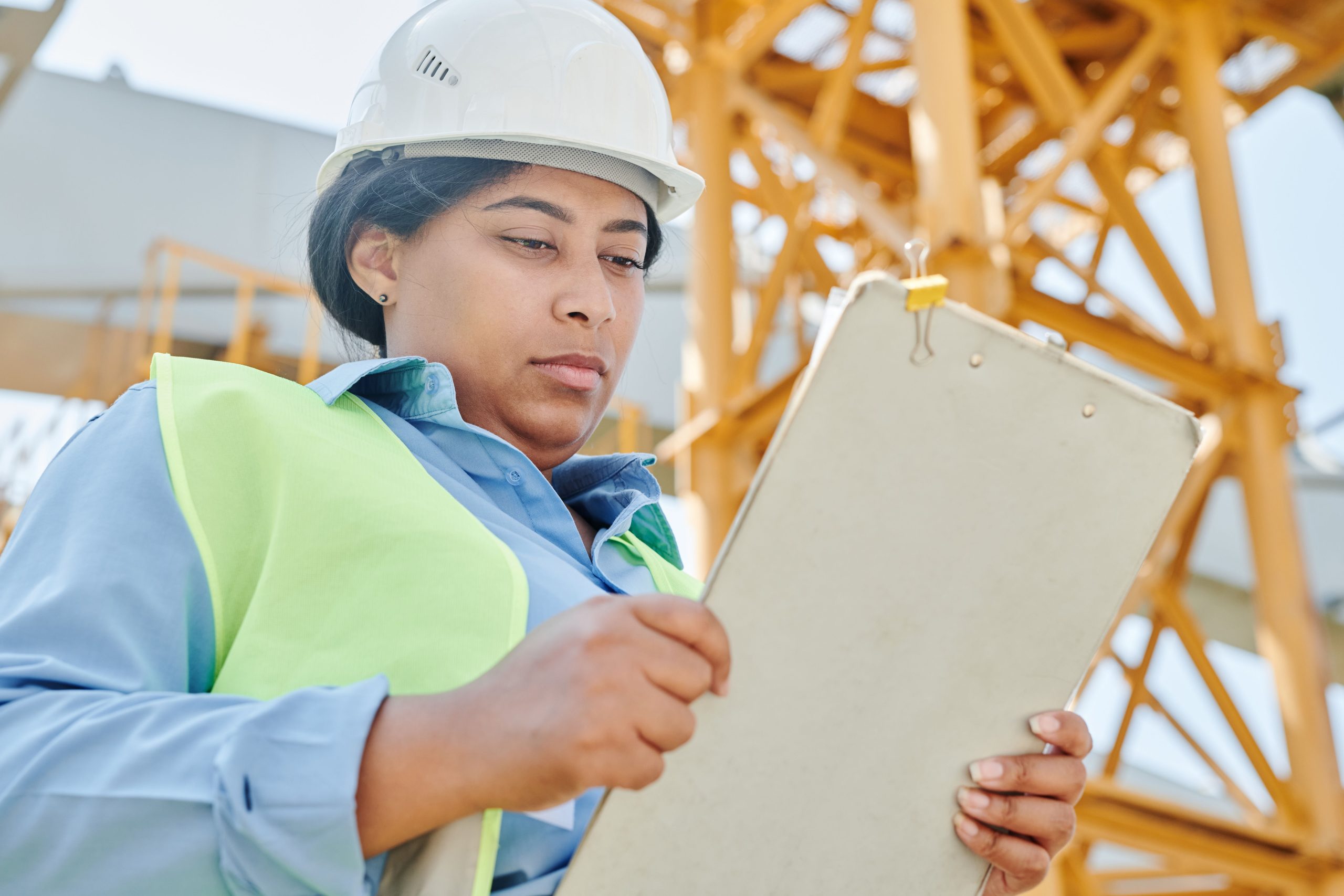 EHS inspector holding clipboard during monthly safety inspection walkthrough